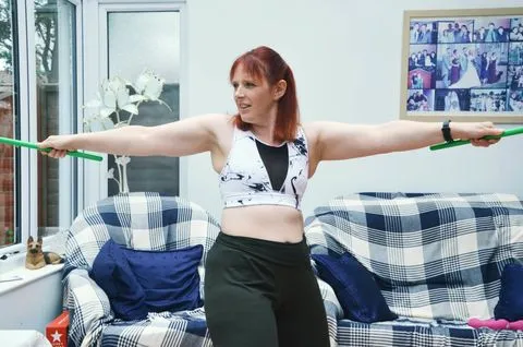 Jo Asplin demonstrating a POUND workout with Ripstix at Willing Spirit Exercise in Bracknell